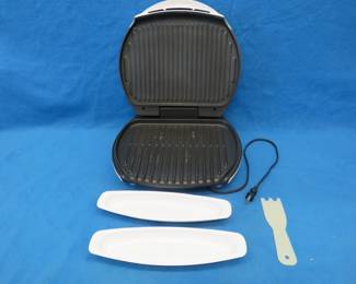 Lot 151. George Foreman grill including scraper and two drip trays also 18 wrapped clothes hangers with 12 pants hangers