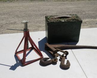 Lot 243. Chain binder, jack stand, and old metal box we couldn't open
