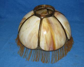 Lot 106. 14" caramel slag glass shade with beaded fringe. Very good condition.