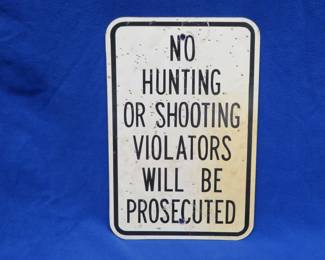 Lot 385. Plastic like No Hunting or Shooting sign that has been hunted