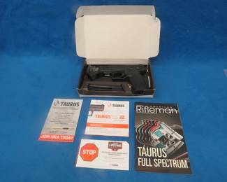 Lot 9. Taurus TX22 .22LR semi-auto pistol. SN 1PT329299. Includes one magazine, manual, and original box.