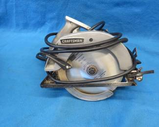 Lot 296. Craftsman 7" circular saw in a metal case. Includes 3 new and 3 used extra blades.