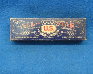 Lot 221. Harmonic Reed Co. All-Star 10-hole diatonic harmonica. Sounds great. Has some surface rust.