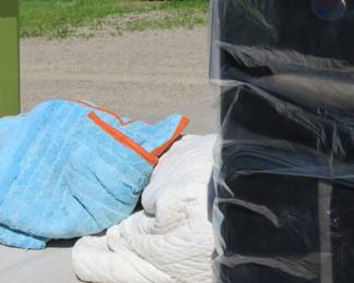 Lot 215. New American Tourister suitcase, two packing blankets and a tote