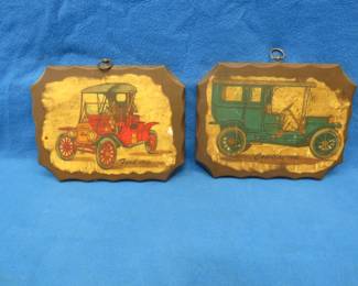Lot 262. Two wall plaques depicting antique cars