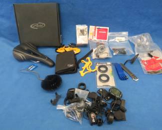Lot 396. Bicycle parts old and mostly new including a Velo Giant seat, cables, and much more