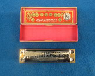 Lot 357. Koch like-new "Bugle Call" 10-hole diatonic harmonica in the key of G. Sounds great. Box is in excellent condition.