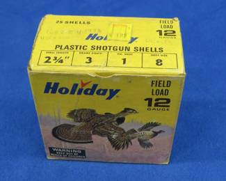 Lot 273. 25 Holiday 8-shot, 12-gauge rounds in a vintage Holiday box with art design by Les Kouba, shells are stamped Holiday too