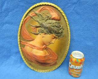 Lot 72. Embossed Bradley and Hubbard #1820 cast iron oval portrait. 14" x 10" x 1".