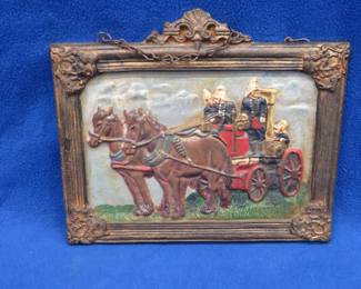 Lot 90. Cast iron plaque showing a horse-drawn fire engine with no markings