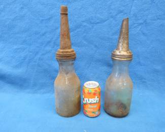 Lot 187. Two antique one quart oil bottles with spouts. Includes one cap.