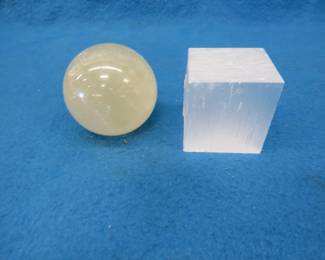 Lot 161. Honey Calcite Sphere and a Satin Spar Cube. Total weight 1.15 lb.