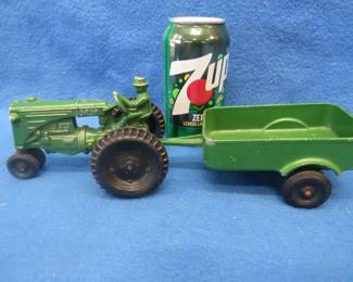Lot 408. Two toy tractors. Minneapolis Moline with a trailer and a John Deere.