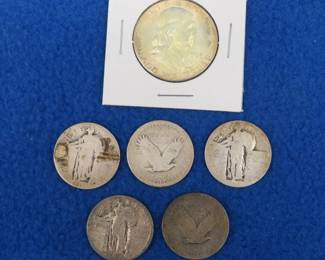 Lot 407. Five Standing Liberty Quarters and a Franklin half-dollar