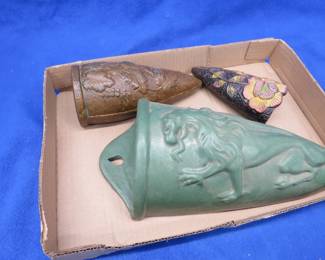 Lot 55. Three pottery wall pockets