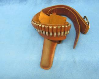 Lot 169. Hunter brand leather ammo belt with a Hunter brand holster. Approx. 34". Used with the gun in lot #144.