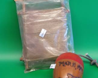 Lot 110. Hand carved wooden bobber and a vintage package of Deep Sea Hand Line