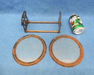 Lot 268. Two 7" round windows in metal frames and an adjustable metal book rack