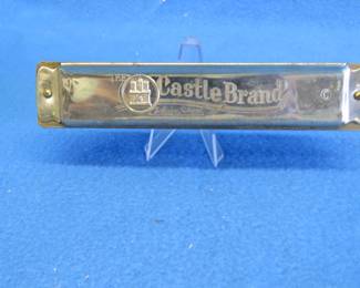 Lot 61. Johann Schrunk Castle Brand tremolo key of C harmonica with 20 holes.