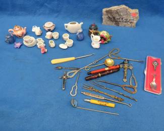 Lot 49. Collectible smalls including boot hooks, a child's play tea set, crucifixes, and more