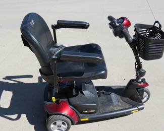 Lot 170. "GoGo" Elite Traveler Pride scouter. Complete and in excellent condition with two brand new batteries. This scooter easily comes apart into three