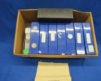 Lot 264. Coin collector organizer kit that includes 15 plastic divider trays for slabbed coins, coin tubes, a mint nickel bag, and more