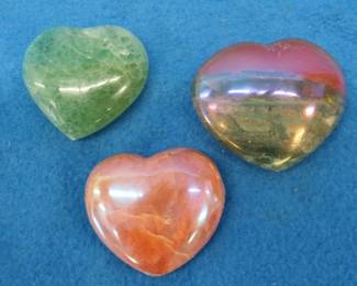 Lot 160. Three heart shapes stones. Flourite, Aura Quartz, and a Peach Moonstone. Total weight of 1.11 lb.