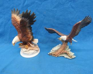 Lot 143. Four porcelain eagles. Two are in their original boxes.