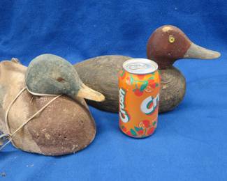 Lot 165. Two vintage duck decoys, one cork and one wooden with glass eyes