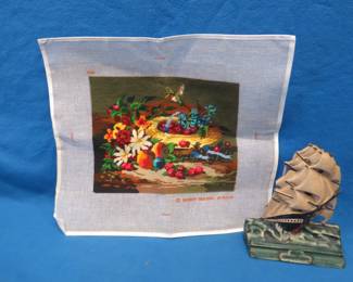 Lot 263. Completed cross stitch and a vintage rubber "Old Ironsides" door stop.