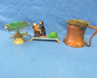 Lot 386. Large copper mug, small office lamp, and a dental-themed mechanical bank from Taiwan