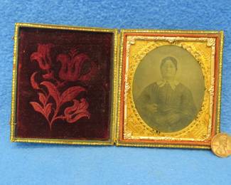 Lot 47. Antique tintype photo in a locking case. Very good condition.