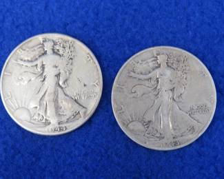 Lot 198. Two Walking Liberty half-dollars