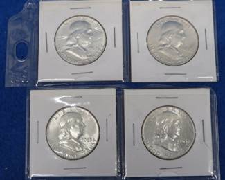 Lot 126. Four Franklin half-dollars