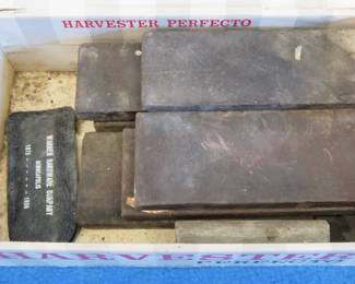 Lot 159. Cigar box with sharpening stones