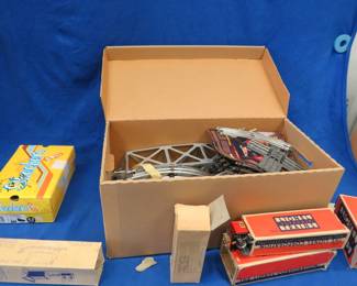Lot 342. Vintage Lionel Train set with lots of cars, track, and some cool accessories