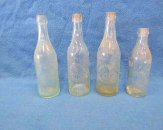 Lot 68. Four old beer bottles: