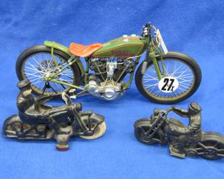 Lot 265. Two vintage cast iron motorcycles, one with rubber tires, and a metal Harley-Davidson
