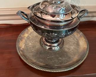 Very old soup tureen with under tray and horse finial.