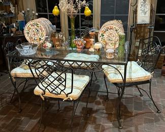 Wrought iron glass top table with four chairs