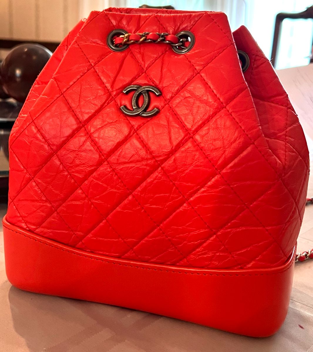 63. Vintage Chanel Orange Gabrielle Quilted Small Backpack  (8" x 3" x 9") 