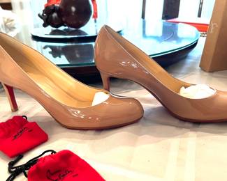 60. Christian Louboutin Nude Patent Pumps 7.5