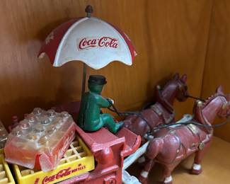 Vintage Cast Iron Coca-Cola wagon with bottles
