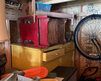 Antique Furniture, Yellow cabinet is metal and has drawers inside.