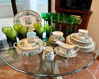 The china and green glasses on the left are sold.