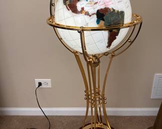 Wonderful globe illuminates from within. Each country is shaped from a gemstone.