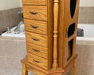 Jewelry storage stands about 4’ tall, and rotates, too.