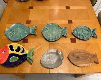 Fish pottery plates, glass appetizer fish plates, and wood cutting board