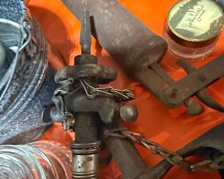 vintage tools and garage items: antique grease guns, glass insulators, and a metal bucket. Great for rustic or industrial decor. #vintagetools #greasegun #industrialdecor #antiques