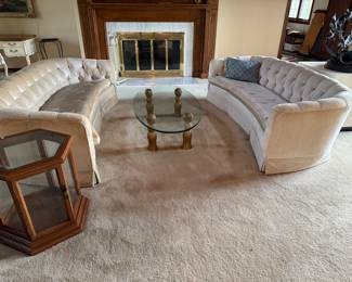Hollywood Regency tufted curved sofas